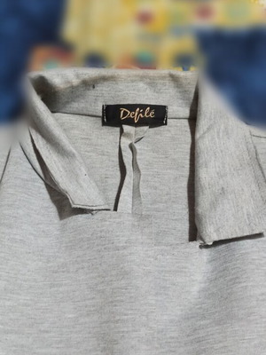 Defile gray jacket used with slight collar wear
