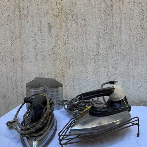 Old irons with stand used, set of two pieces