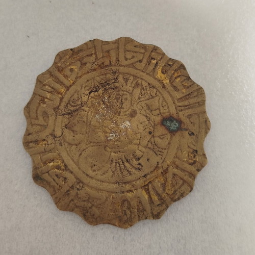 Small vintage brass object used with carved figure