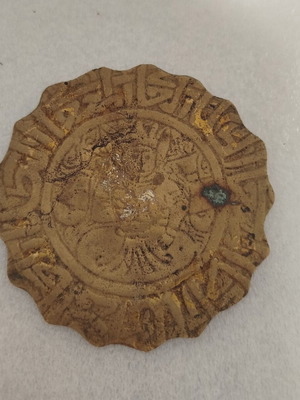 Small vintage brass object used with carved figure