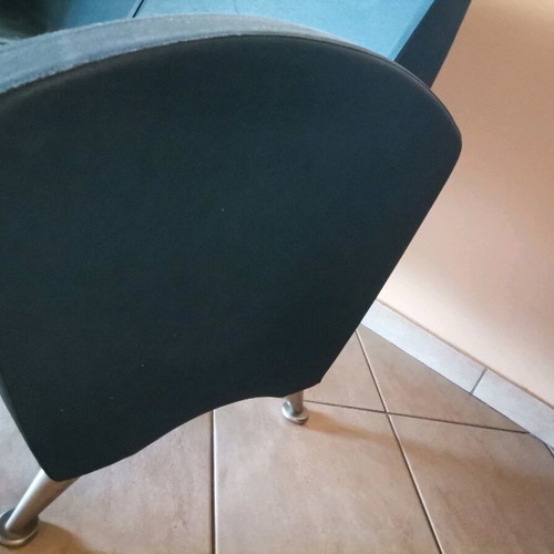 Two-seater sofa used with metal legs blue leatherette