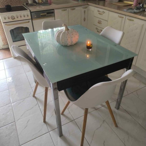 Extendable dining table with four chairs used, leather seats