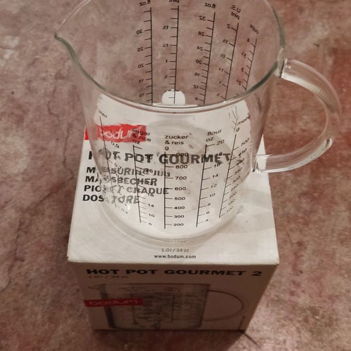 Glass measuring cup used for solids and liquids