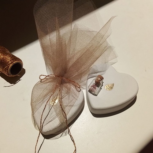 Wedding favors scented plaster heart with gold leaf and glass bottle