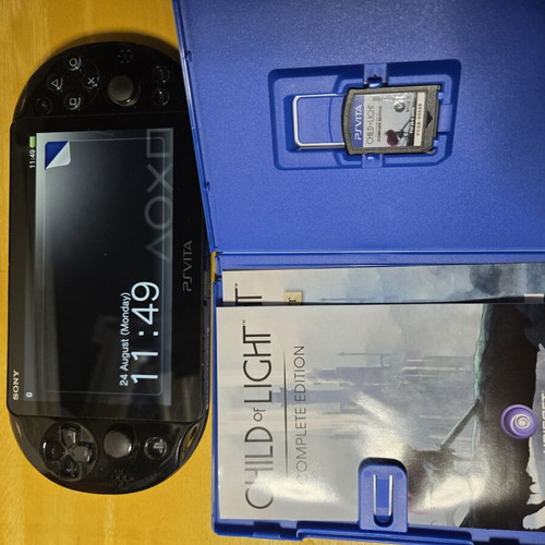 Sony PS Vita Slim console with 8GB card and games