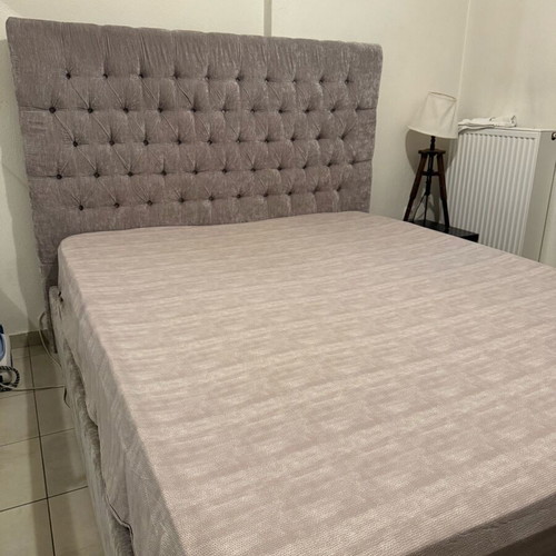 Double bed with water-repellent grey beige fabric and mattress like new