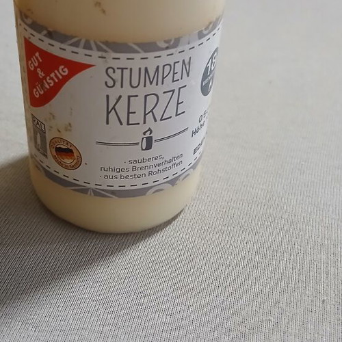 Set of 2 new candles, one with small dent