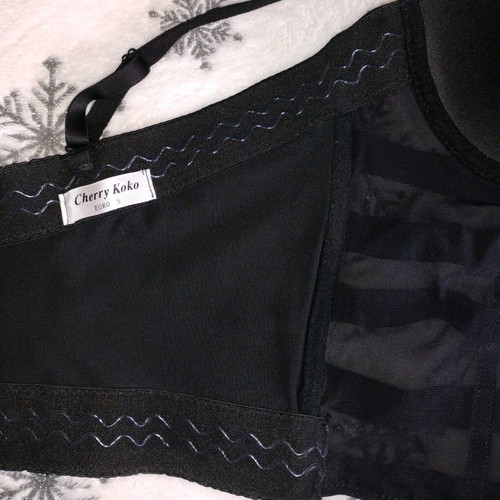 Black bustier used with transparency and adjustable straps