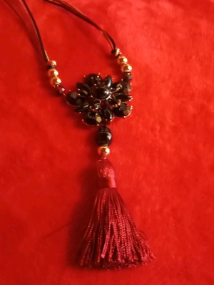 Handmade necklace with central rosette like new