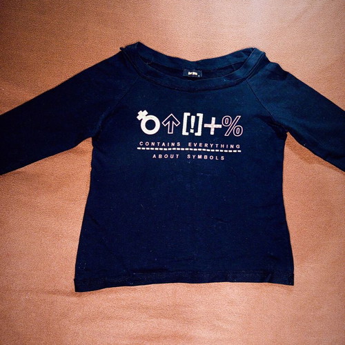 Be You black blouse used with graphic print and symbols