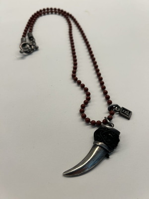 Unisex necklace like new, burgundy with silver tooth pendant