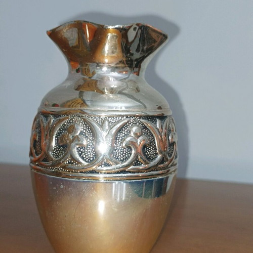 Decorative metal vase used, silver color with embossed design