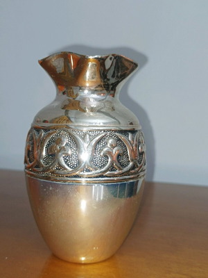 Decorative metal vase used, silver color with embossed design