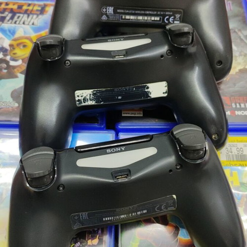 PlayStation 4 Slim 500GB like new with 4 games and 3 controllers