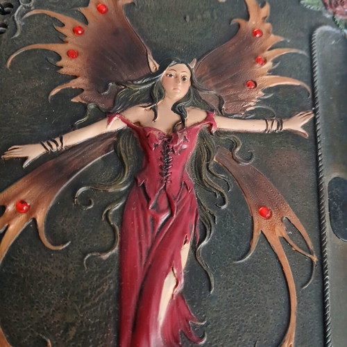 Iron notebook like new with embossed designs and magnet