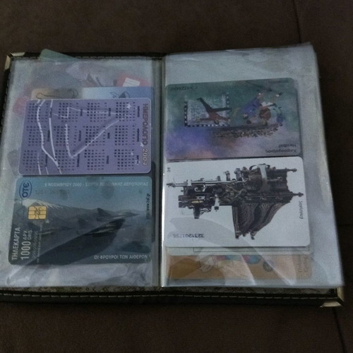 Collectible old phone cards used with album