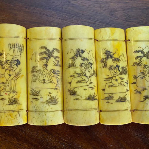 Vintage Asian folding bone carving with erotic scenes in natural ox bone