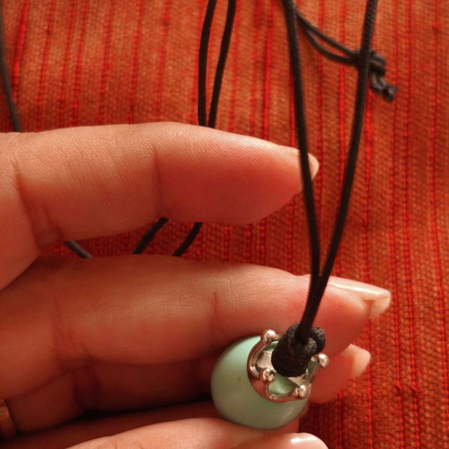 Handmade necklace with crown pendant and teardrop stone, used