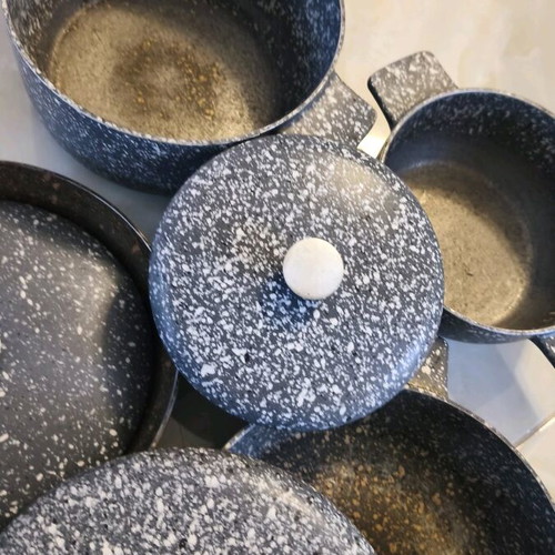 Heavy cookware set used with lids and large frying pan