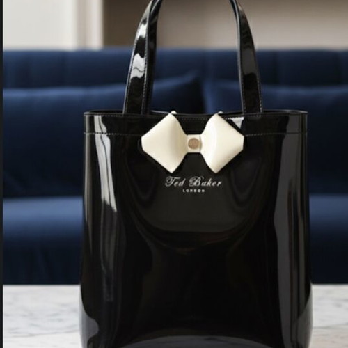 Ted Baker waterproof handbag like new, black with white bow