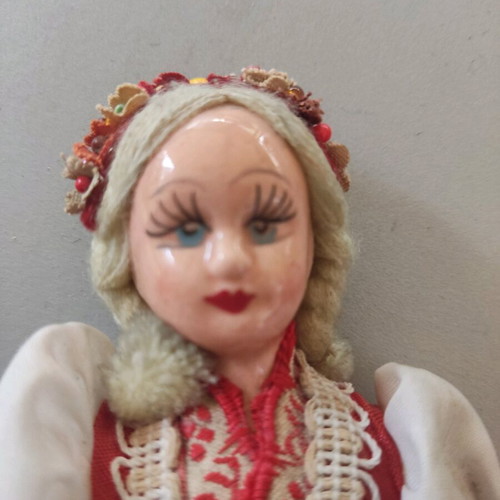 Vintage doll used with porcelain head and embroidered apron
