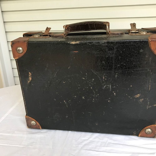 Small antique suitcase used with wear