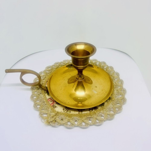 Vintage brass candlestick with handle and drip plate, used