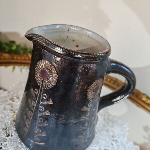 Retro ceramic milk jug with embossed flowers