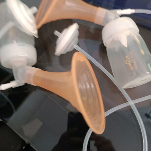 Spectra electric breast pump used with charger and tubes