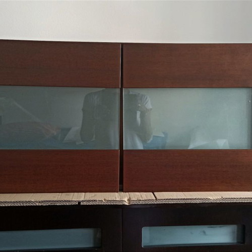 Wall cabinet used, brown color with glass and wood