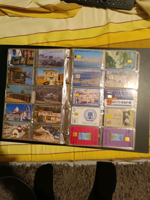 Phone cards collectible like new, about 400 with albums