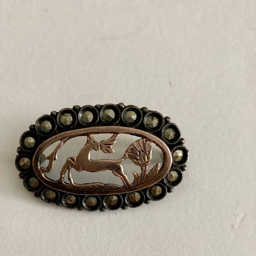 Silver brooch with gold and marcasites
