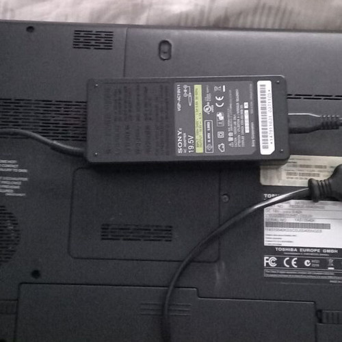 Toshiba Satellite C660D-10D laptop used with charger and accessories