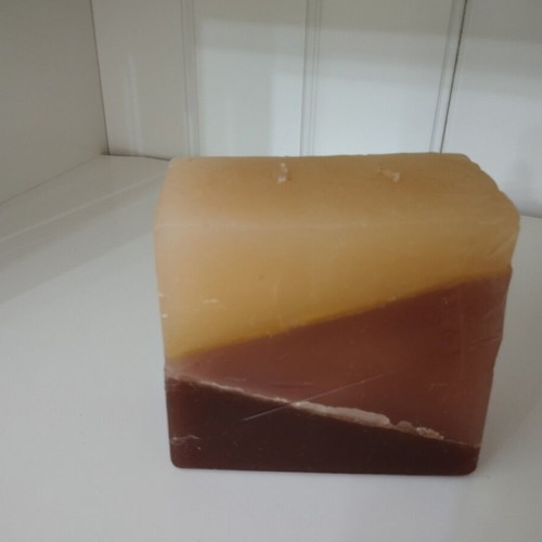 Handmade decorative candle used with layered minimal design