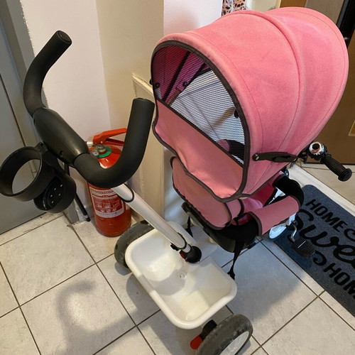 Tricycle pink with parent-controlled steering used