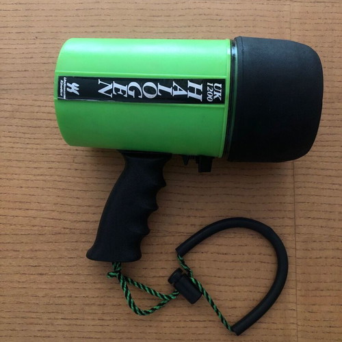 Underwater Kinetics UK1200 halogen underwater flashlight used with handle and strap