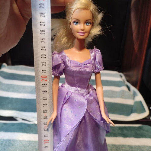 Barbie with lilac dress used, torn shoulders