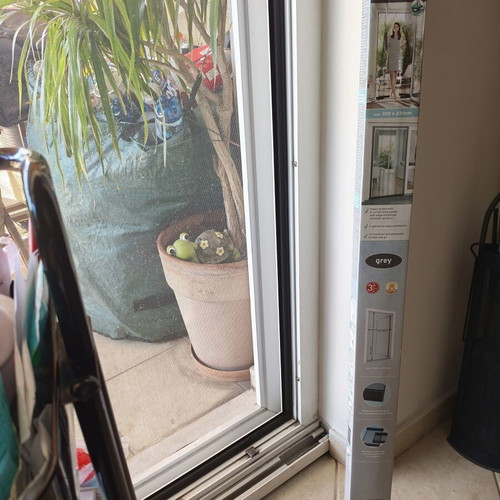 Door screen new with strips and adhesive base