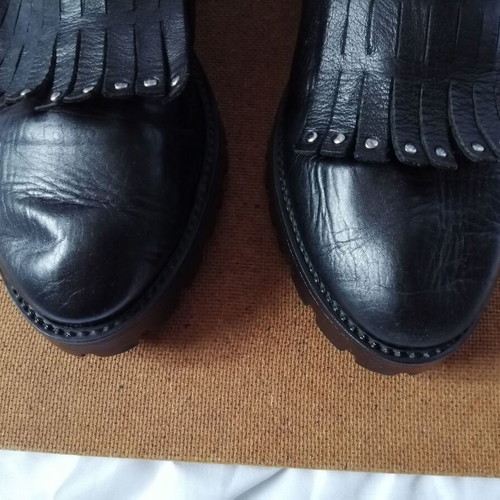 Women's black leather loafers with tassels and snap buttons, size 37
