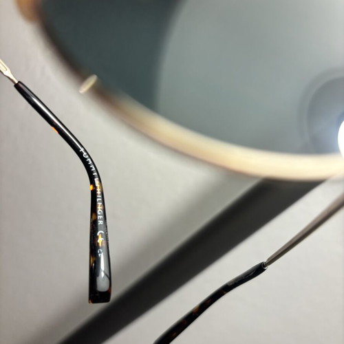 Tommy Hilfiger sunglasses with gold frame and dark lenses