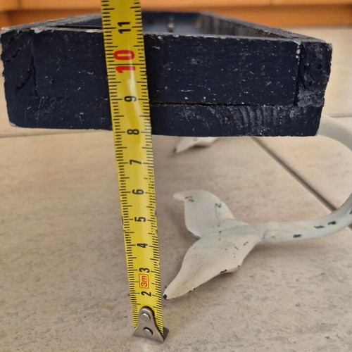 Wall hanger with 3 whale tails on blue wood like new