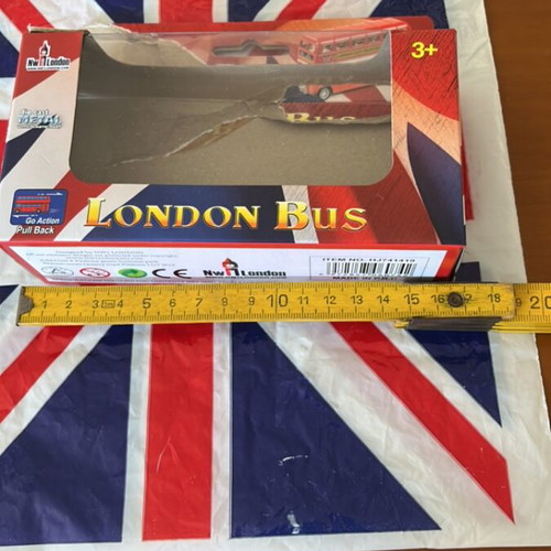 Plastic bag with English flag and small empty London bus box like new