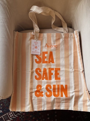 Large shoulder beach bag made of recycled material, beige and orange
