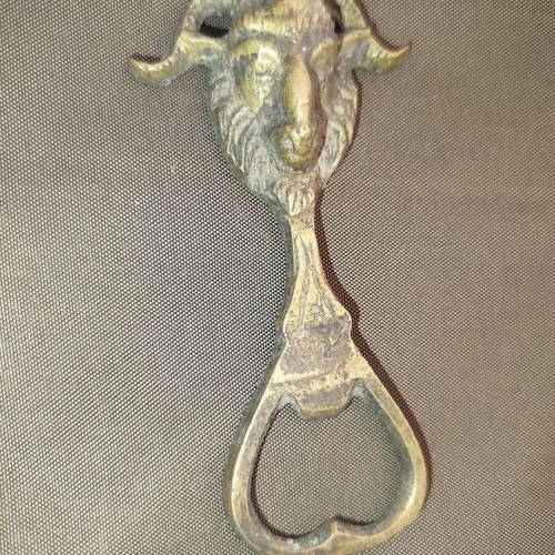 Bronze bottle opener used