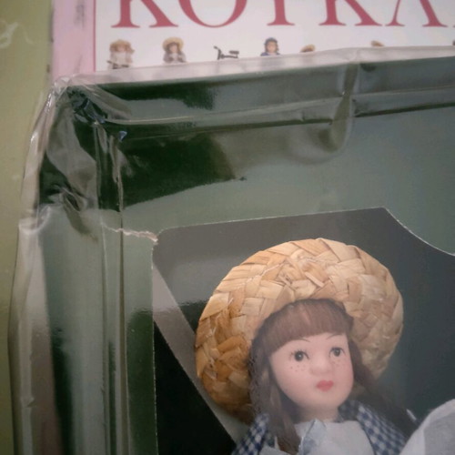 Porcelain doll with wooden seesaw miniature new