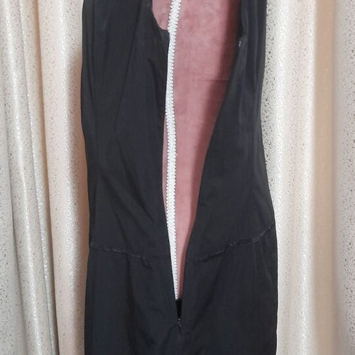 VS black sleeveless dress with round neckline and pleats, size 50