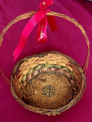 Wicker Easter basket used with red ribbon
