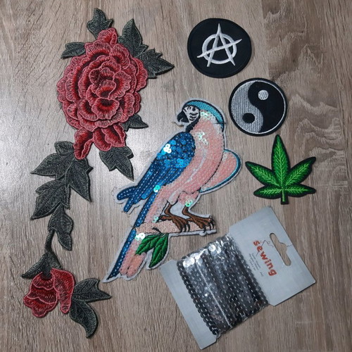 Iron-on patches for garments used with sequins and embroidery designs