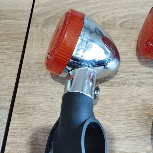 Motorcycle turn signals new with chrome base and orange cover
