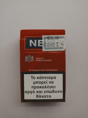 Empty hard pack of NEXT cigarettes used